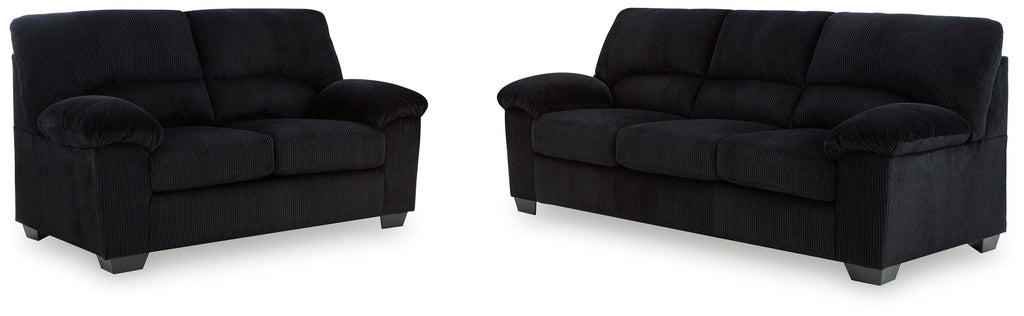 Onyx sofa and loveseat set on white background