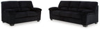 Onyx sofa and loveseat set on white background