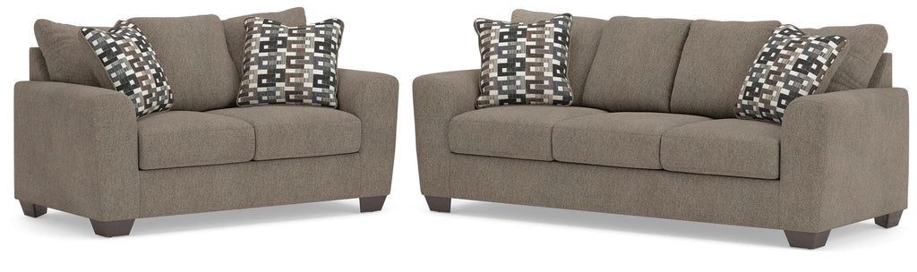 Suede-color sofa and loveseat set on white background