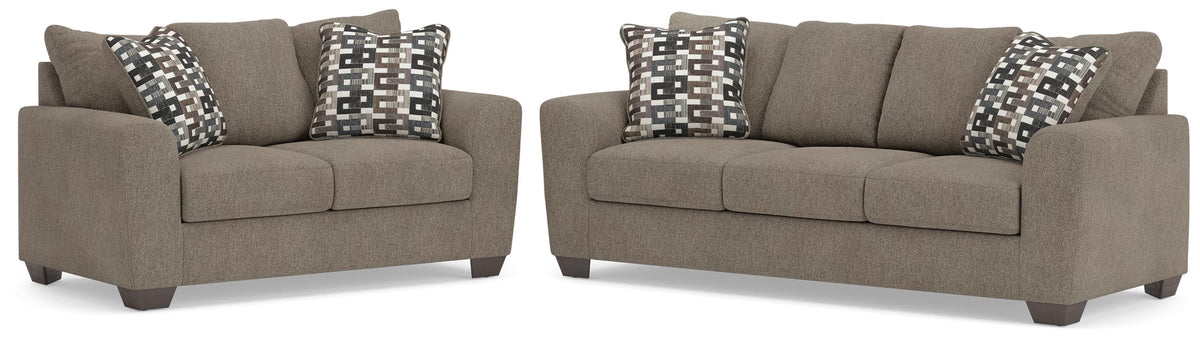 Suede-color sofa and loveseat set on white background