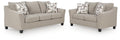 Taupe sofa and loveseat set on white background