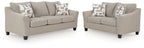 Taupe sofa and loveseat set on white background